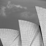 8.0 - A fine art edition of an iconic building from down under. The image is tack sharp and properly exposed. To me, the visual impact would be enhanced with a more belligerent sky. The new Lightroom masking tool allows for the selection of the sky that can be manipulated like any normal image. In camera, this darkening of the sky and improved contrast would be made possible with a red filter that I think would make this image pop. I like that you maintained a matching space along the top and left side for balance. A nice choice of subject for a black and white image.