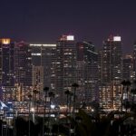 8.0 - Thank you for a straight horizon. This is a lovely image of SanDiego, though I think a bit too dark. There are a number of ways tobrighten the cityscape. I think the dark trees (maybe lightened just atouch) of the foreground and a brighter background of buildings wouldreally offset each other. I like your choice of building-to-sky ratio. Thefocus on the buildings is a little soft. A very enjoyable image.