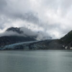 5.94 - The weather really wasn’t much help for you. It looks like a beautiful area. You have done pretty much what you could get on a cloudy day. There is some color in the glacier but it would be hard to make it look like much more than a rock slide. You might try cropping off the mountain on the right side and up from the bottom to remove the blank water. I am wondering if you were on a boat that was passing this scene. I think that if the clouds weren’t hanging in the valley, that there might be a nice “S” curve if the position was right when the boat was passing.