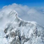 2nd - 8.58 - Good sharp image. I like how the cloud and blowing snow partially conceal the peak on the left somewhat like a vignette. The brighter mountain is set off nicely by the darker clouds behind it. Nice image.
