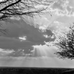 7.0 - Nice capture of the rays. I would darken the sky to give it more impact and bring out the rays stronger. Level the horizon.