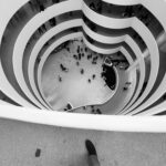 8.0 - Looking down at the people gives it a good perspective for me. I get the feeling of the size. I understand the reason for the feet but feel that they distract more than add to the image.