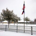 5.94 -The pole and the flags are well placed in the composition. The colors of the flags also make a good focal point for the viewer. The snow on the trees show that it had been blowing in from the left side. If you could have been here earlier, you might have been able to get the flags blowing to the right so they would haven’t have been behind the flagpole.