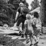 6.2 - This photo has great composition – the diagonal “stairway,” the tree trunk stopper in the upper left, and the two girls in the lower right strong composition location. Of course, it might be better if the faces were visible. In my opinion, the photo has a little too much contrast.