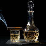2nd - 6.8 - This is a high impact photo, with a stark black background, distinctive subjects, and a swirl of smoke for interest. However, the overexposed highlights, particularly on the left side of the neck of the decanter, are very distracting. Also, it’s too bad the smoke is swirling to the left, perhaps leading the viewer’s eye out of the frame.