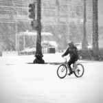 7.26 - This does not look like it would be any fun at all. The subject is placed well in the image. His dark clothing somewhat helps to give balance to the stop light. The streaks of heavy falling snow add interest to the story. I don’t know if it would be possible to get a little detail of the riders face or if it was completely covered. Some detail of an expression would have been a nice touch.